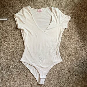 White v-neck bodysuit from Pink Lily. Fabric is super soft